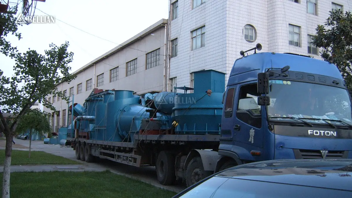 Wide shot of full barite grinding line equipment loaded on heavy truck, leaving factory for port shipment to Kenya