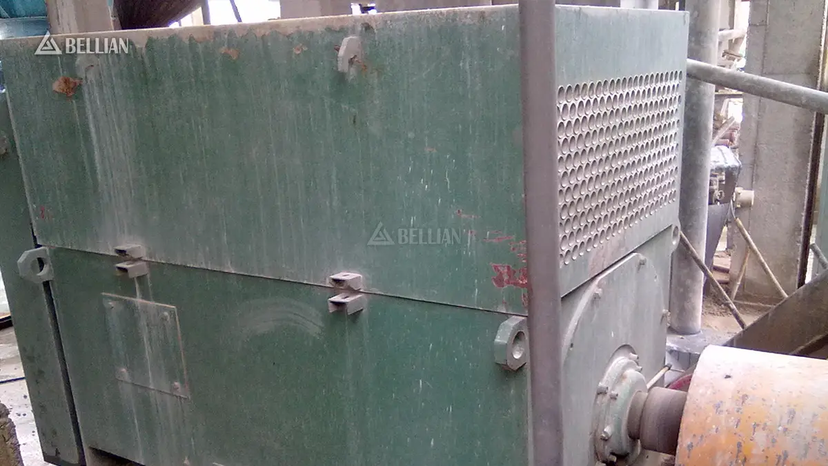 Vertical roller mill drive motor and auxiliary hydraulic equipment close-up at Vietnam slag project site