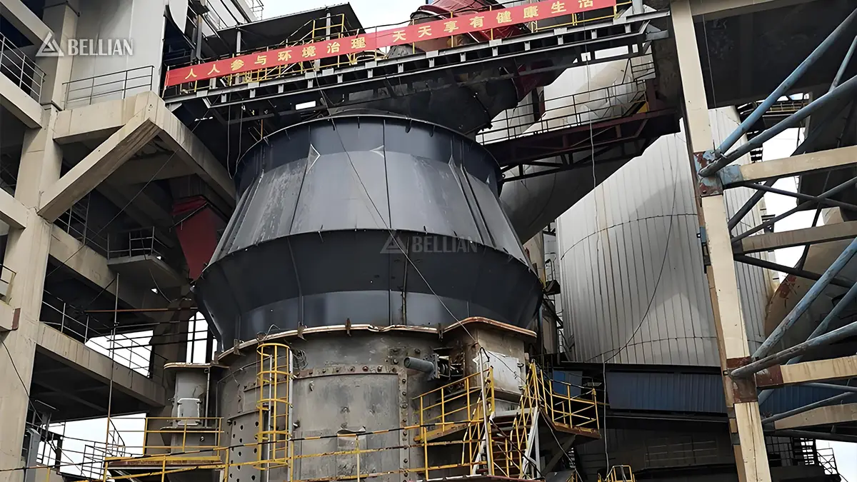 Close shot of vertical roller mill main body with maintenance platform and safety guardrail on site in Saudi Arabia